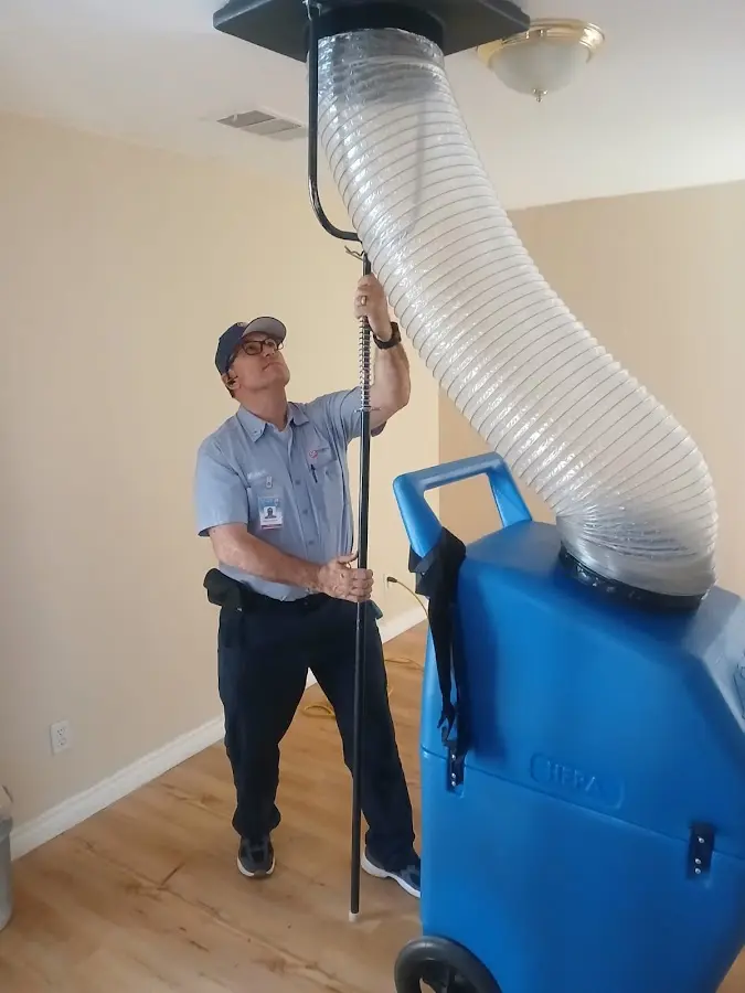HVAC Installation technician using HEPA equipment in Merrill